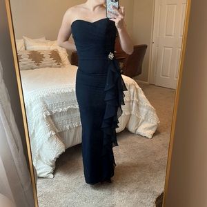 Formal dress with ruffle and bead accent